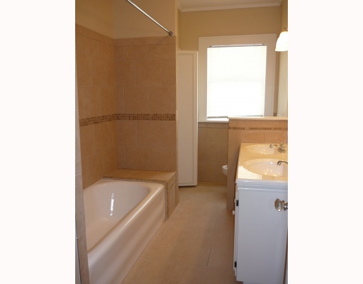 421 Cole Street Corpus Christi, TX 78404 - Photo 9 of 10 a bathroom with a bathtub and a shower