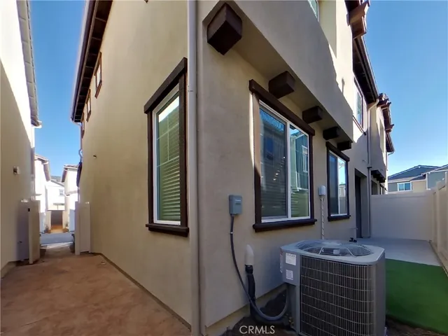 a front view of a house with many windows