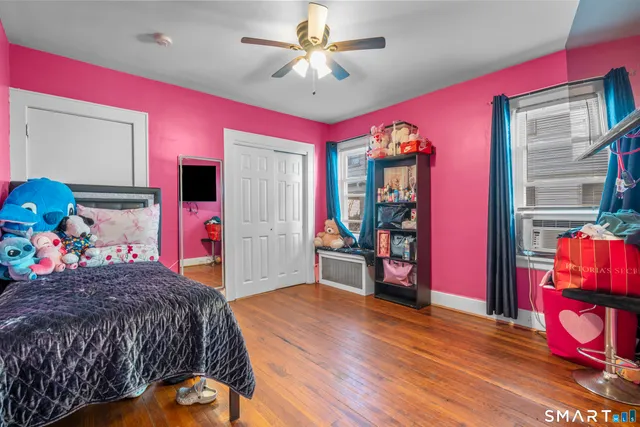 a bed room with a bed and a window