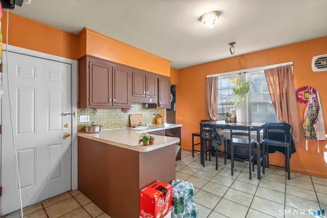 a view of a dining table and chairs in a room