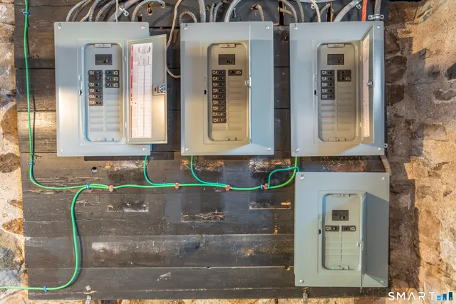 a couple of cars parked in front of a house