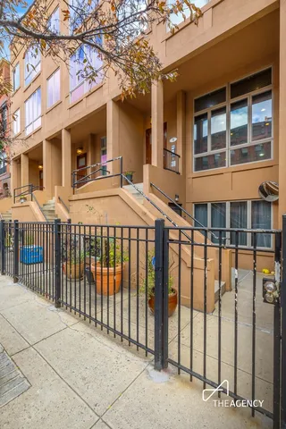 a front view of a building with a iron gate