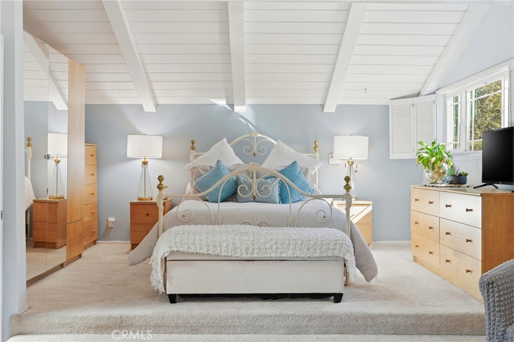 4963 Haskell Avenue Encino, CA 91436 - Photo 25 of 45 a living room with furniture and a table