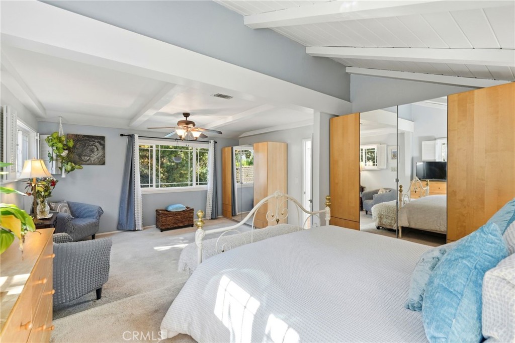 4963 Haskell Avenue Encino, CA 91436 - Photo 27 of 45 a bedroom with a large bed and large windows