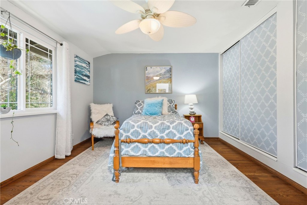 4963 Haskell Avenue Encino, CA 91436 - Photo 28 of 45 a bedroom with a bed and a chandelier