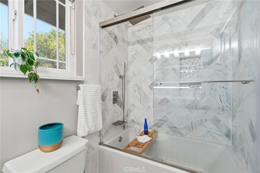4963 Haskell Avenue Encino, CA 91436 - Photo 31 of 45 a bathroom with a shower and a sink