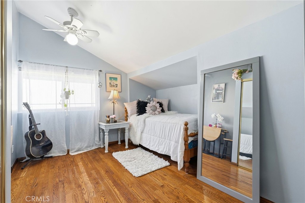 4963 Haskell Avenue Encino, CA 91436 - Photo 32 of 45 a bedroom with a bed and a chandelier