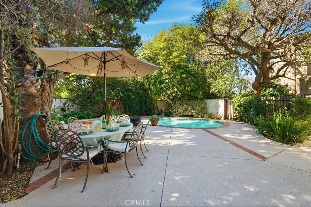 4963 Haskell Avenue Encino, CA 91436 - Photo 34 of 45 an outdoor space with furniture and umbrella