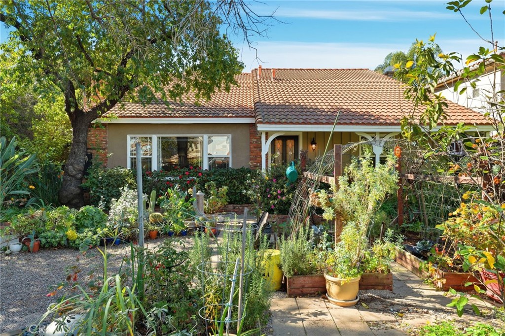 4963 Haskell Avenue Encino, CA 91436 - Photo 4 of 45 a front view of a house with a garden