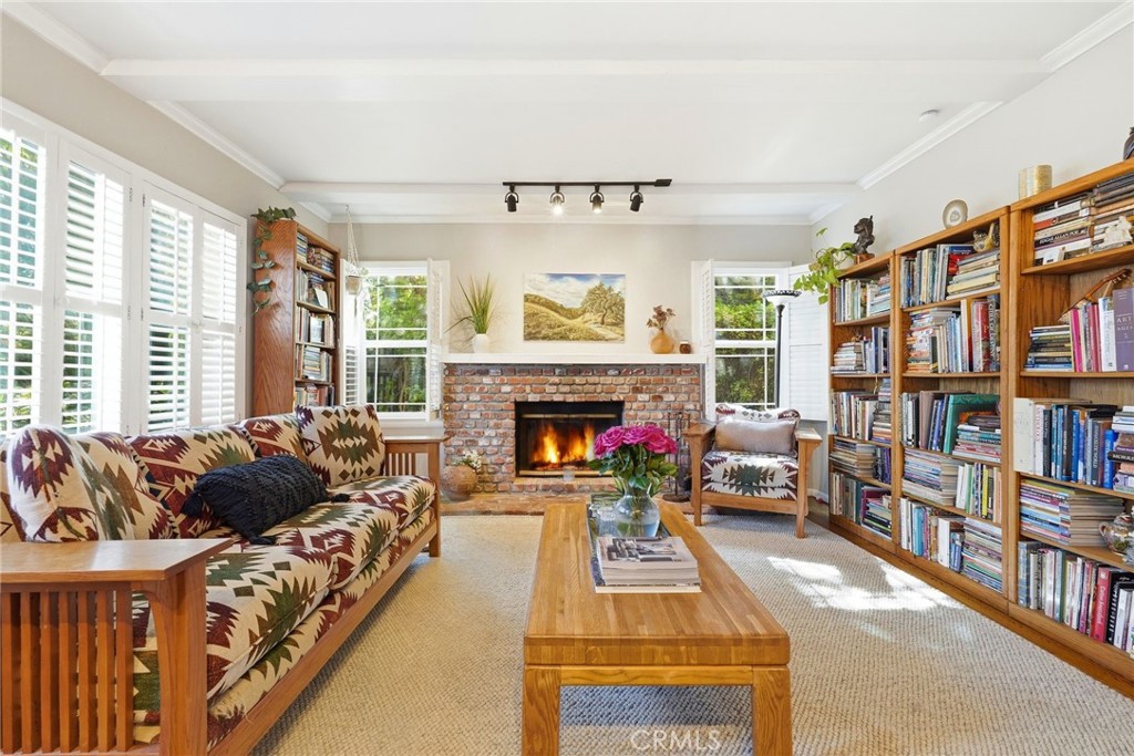 4963 Haskell Avenue Encino, CA 91436 - Photo 7 of 45 a living room with furniture and a fireplace