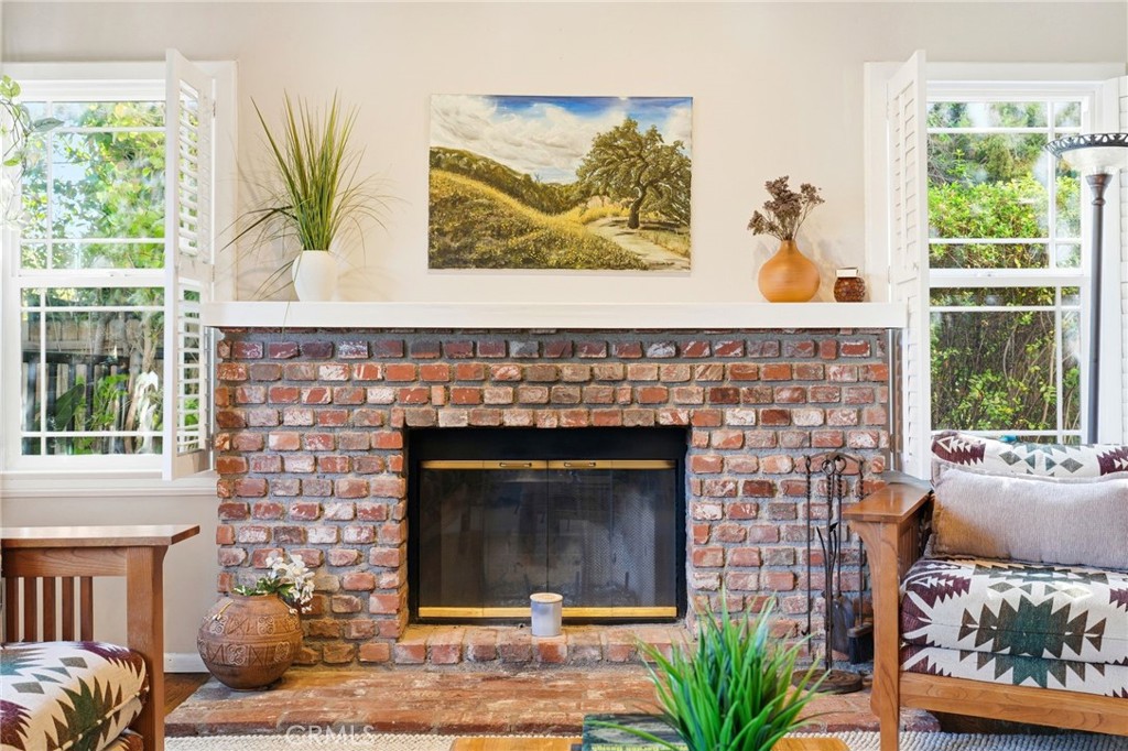 4963 Haskell Avenue Encino, CA 91436 - Photo 9 of 45 a living room with a fireplace windows and a fireplace