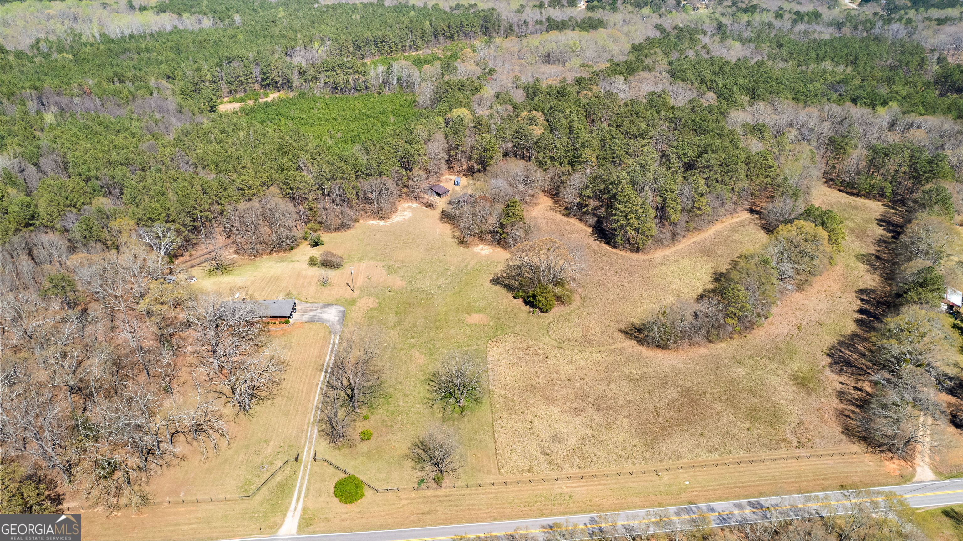 461 Old Jackson Road McDonough, GA 30252 - Photo 15 of 41 a view of a dry yard with wooden fence