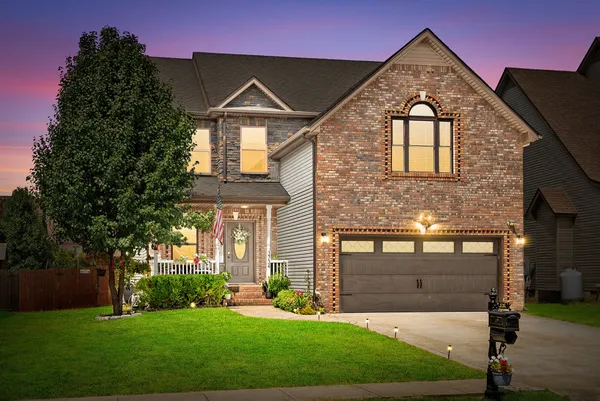 a front view of a house with a yard