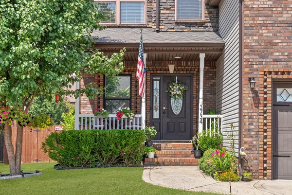 a front view of a house with garden