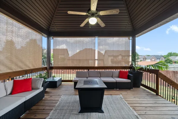 a view of a terrace with couches and pool
