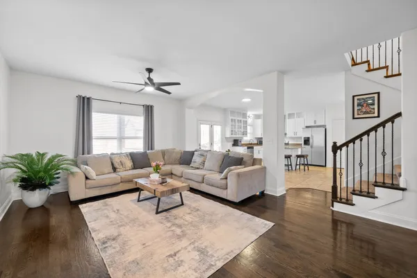 a living room with furniture or couch and a potted plant