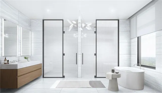 a bathroom with a double vanity sink a mirror and a bathtub