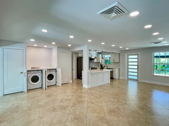 a view of a kitchen with furniture and a ceiling fan