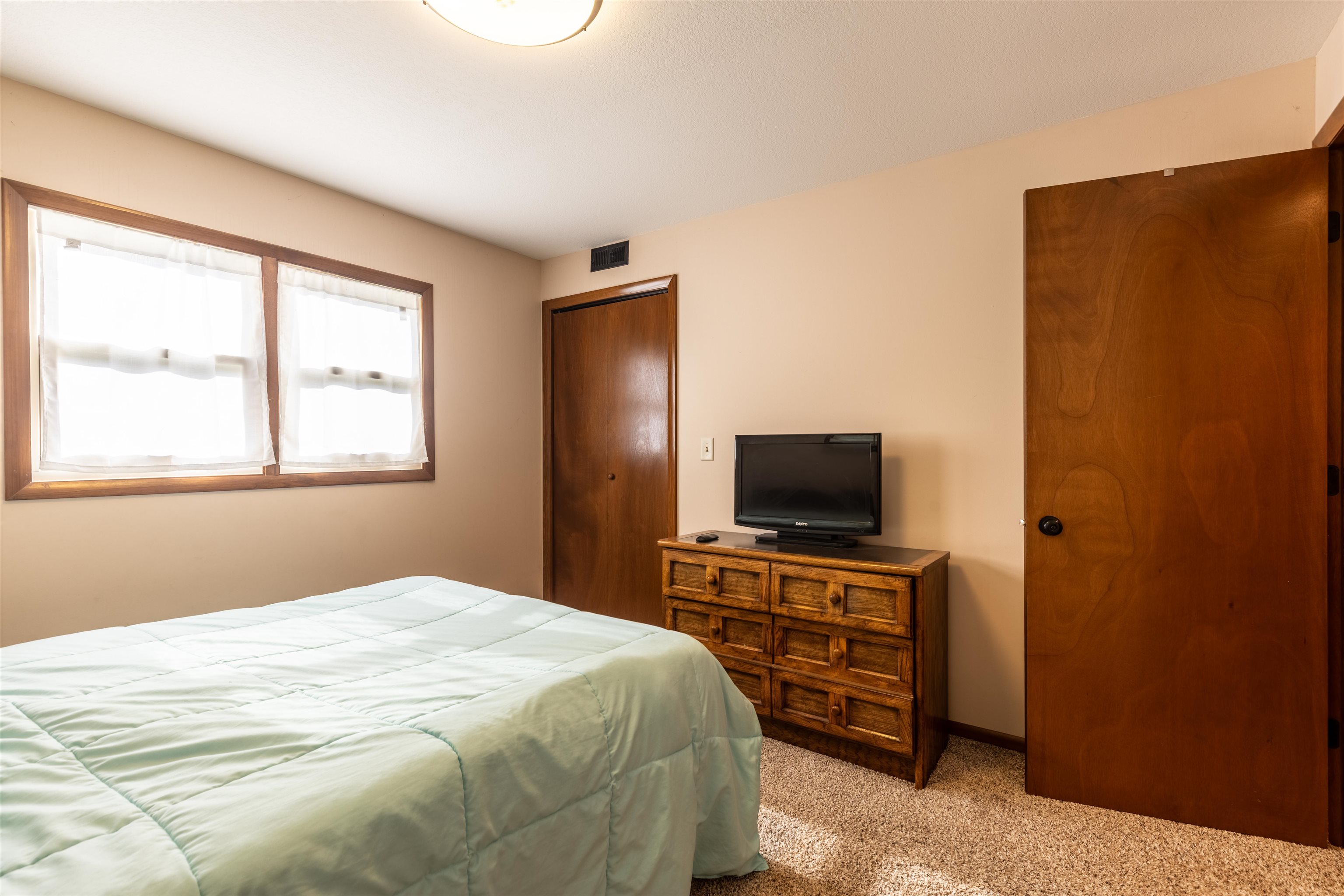 14 Timberon Trail Galena, IL 61036 - Photo 14 of 31 a bedroom with a bed and a flat screen tv