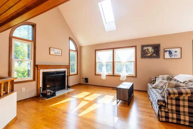 a living room with furniture window and a fireplace