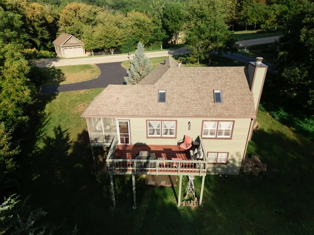 a aerial view of a house with table and chairs