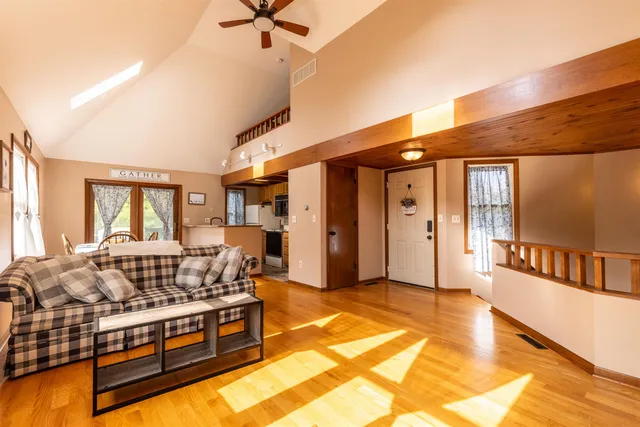 a living room with furniture fireplace and a flat screen tv