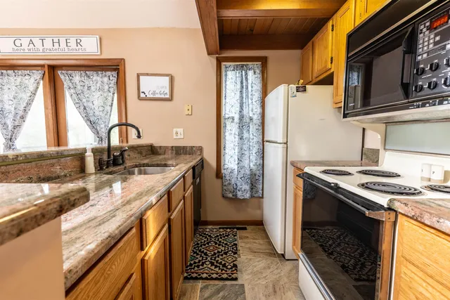 a kitchen with a stove and a sink