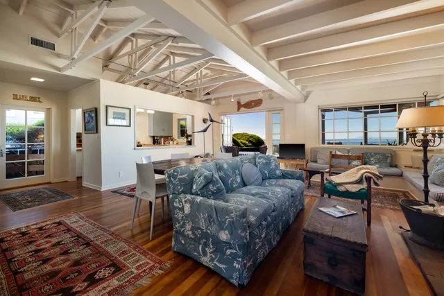 a living room with furniture and a rug