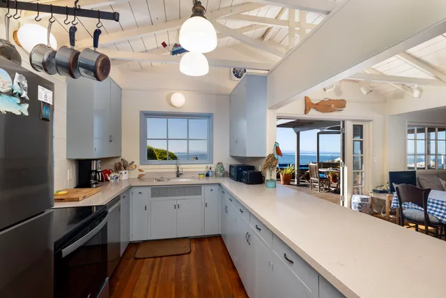 a view of a chairs and table on the deck
