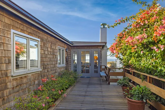 a outdoor dining space with furniture and window