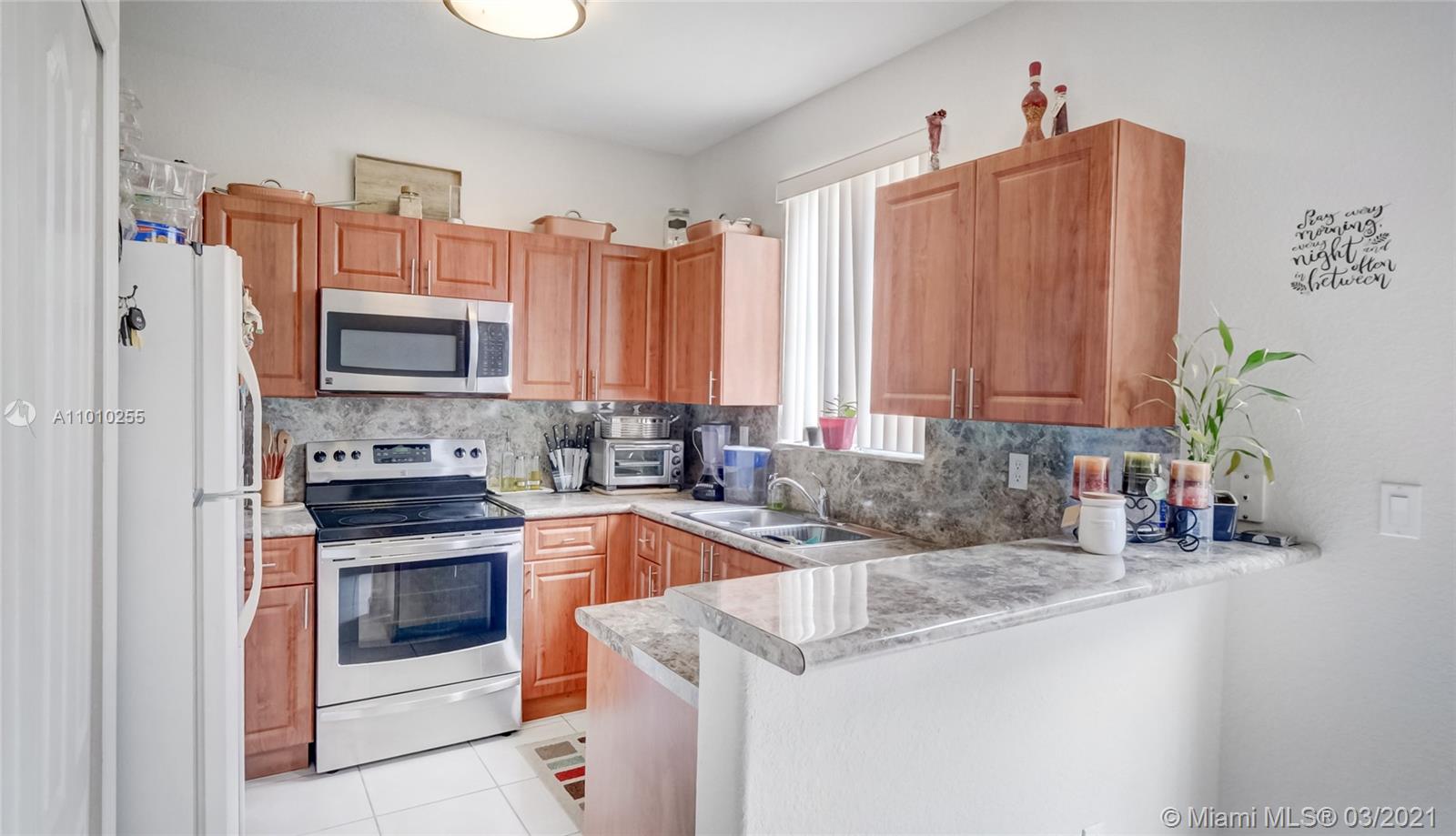 6980 Northwest 177th Street, Unit L102 Hialeah, FL 33015 - Photo 13 of 45