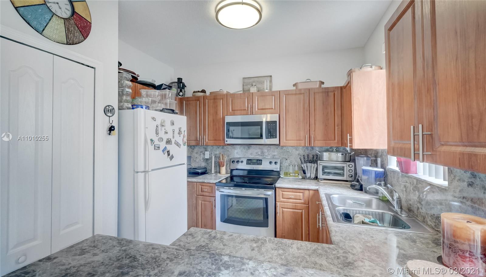 6980 Northwest 177th Street, Unit L102 Hialeah, FL 33015 - Photo 14 of 45