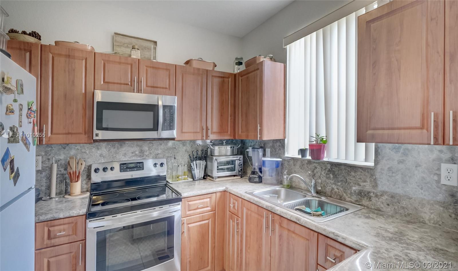 6980 Northwest 177th Street, Unit L102 Hialeah, FL 33015 - Photo 15 of 45