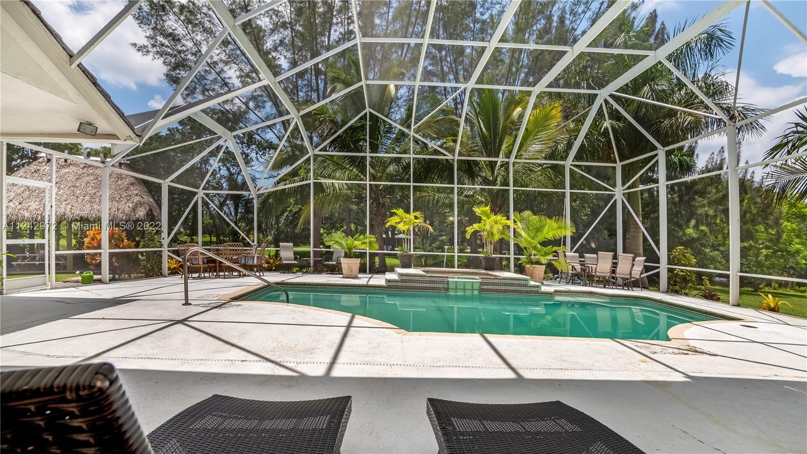 20310 Southwest 48th Street Southwest Ranches, FL 33332 - Photo 18 of 25 a view of a patio with a yard