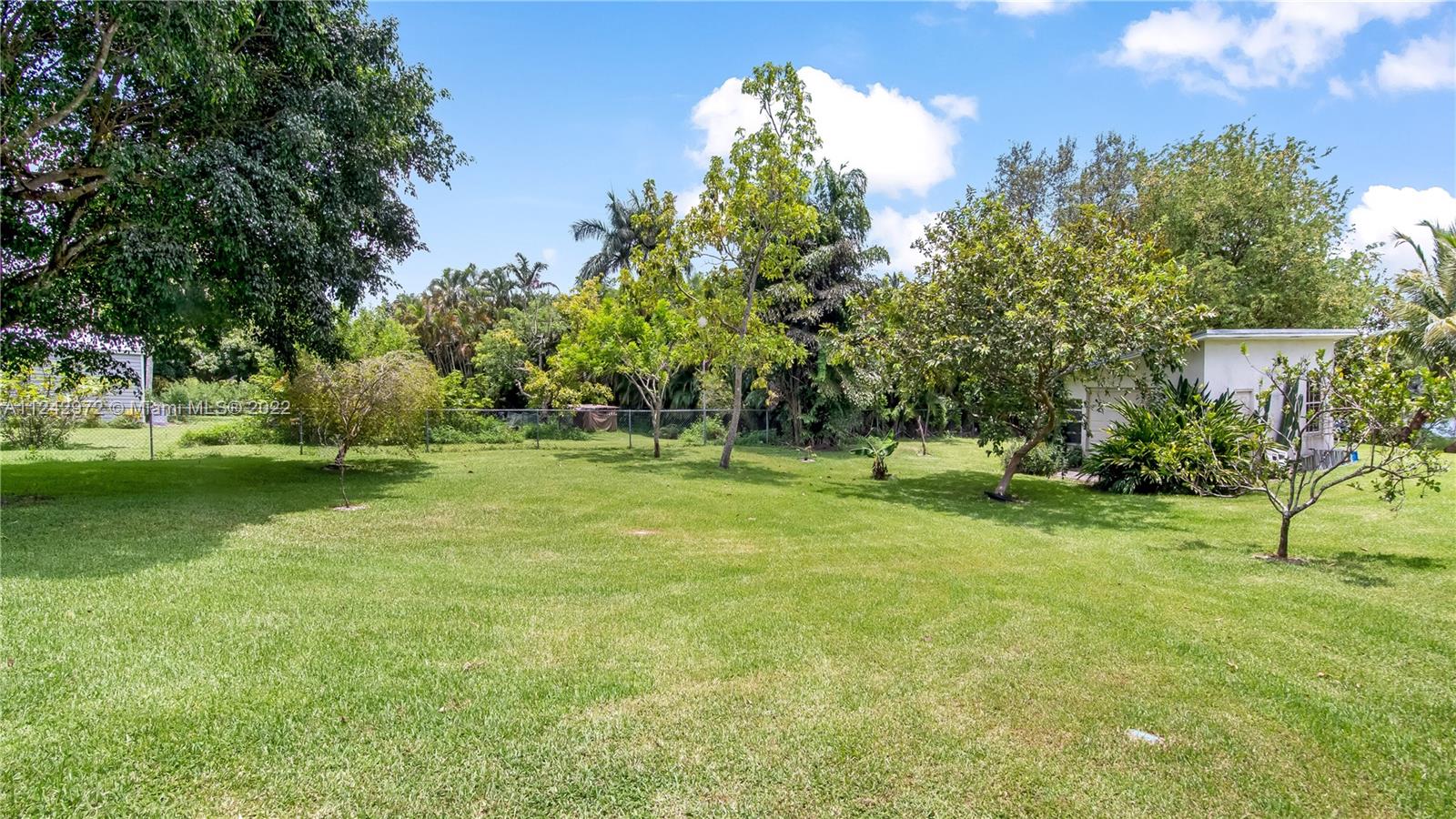 20310 Southwest 48th Street Southwest Ranches, FL 33332 - Photo 23 of 25 a garden with trees in the background