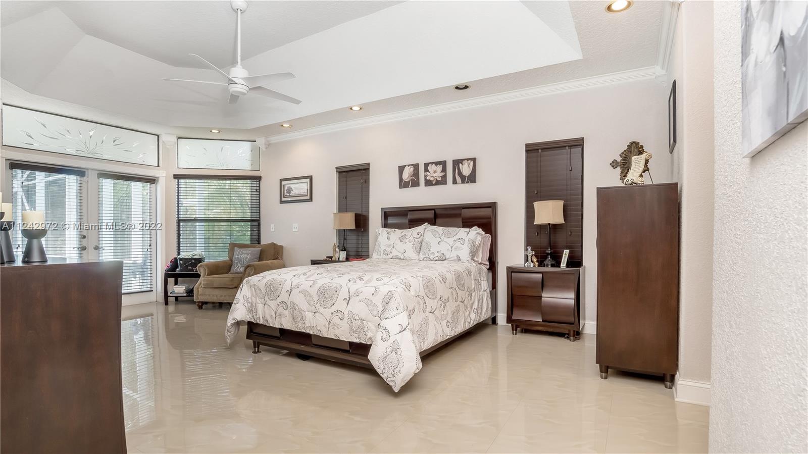 20310 Southwest 48th Street Southwest Ranches, FL 33332 - Photo 9 of 25 a bedroom with a bed couch and large window
