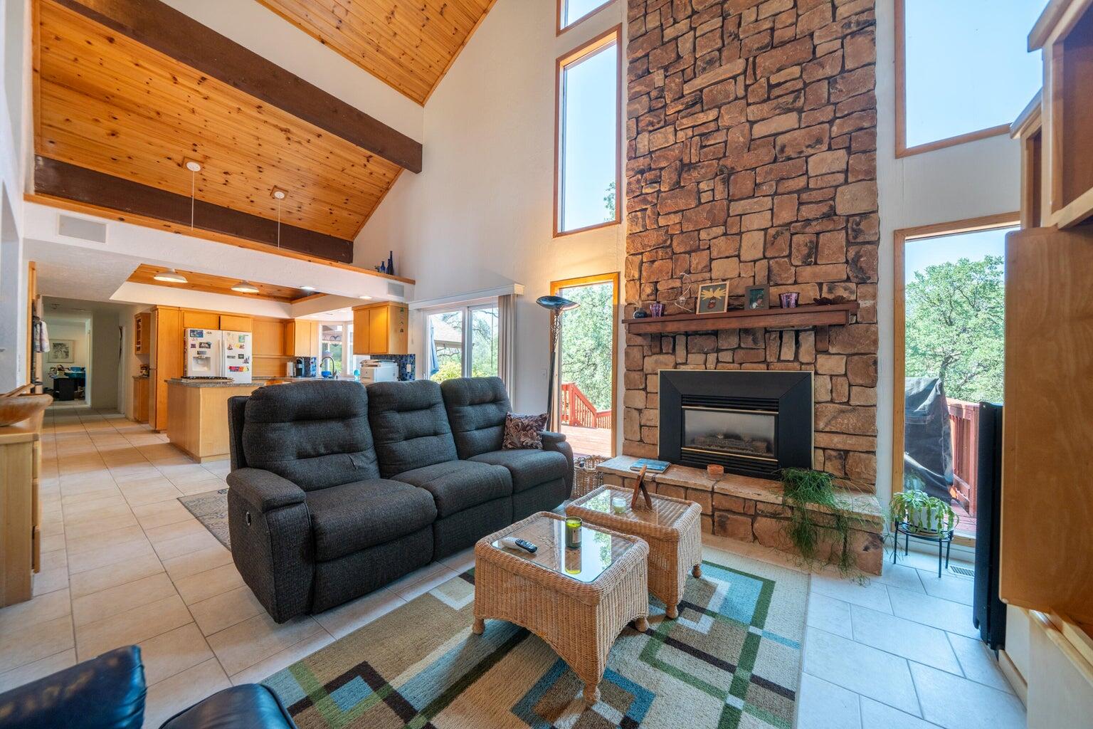 8846 Goldstone Lane Redding, CA 96001 - Photo 13 of 64 a living room with furniture and a fireplace