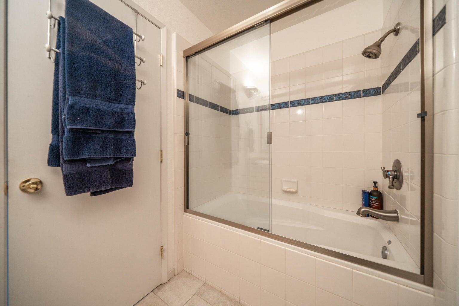 8846 Goldstone Lane Redding, CA 96001 - Photo 37 of 64 a bathroom with a shower and a bath tub