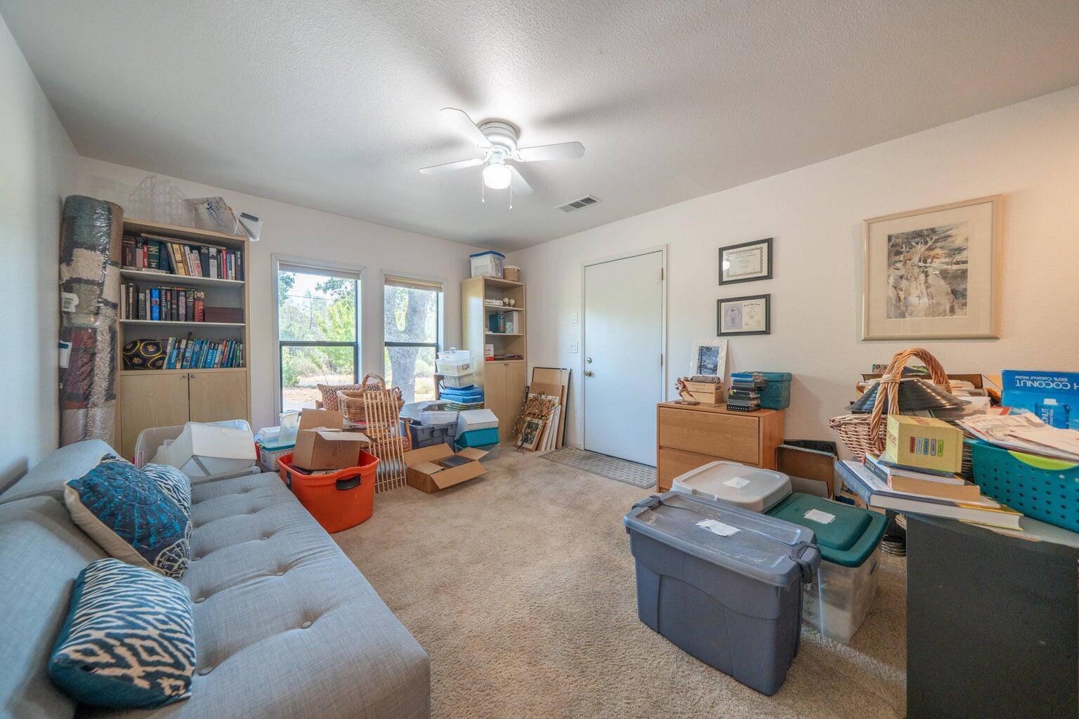 8846 Goldstone Lane Redding, CA 96001 - Photo 38 of 64 a living room with furniture and a large window