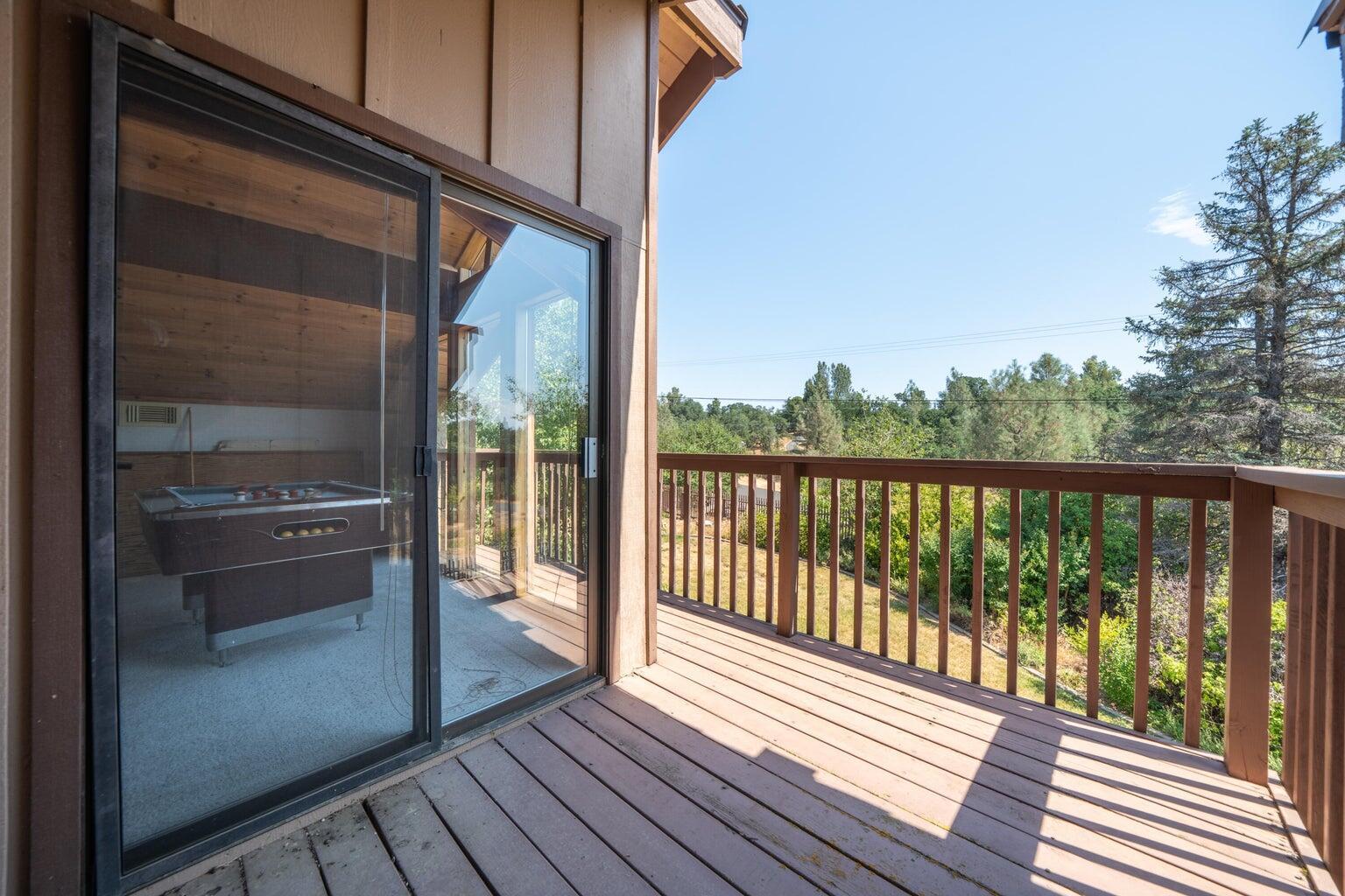 8846 Goldstone Lane Redding, CA 96001 - Photo 46 of 64 a view of balcony with wooden floor