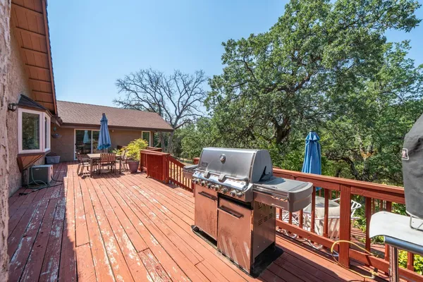 an aerial view of a house with swimming pool and sitting area