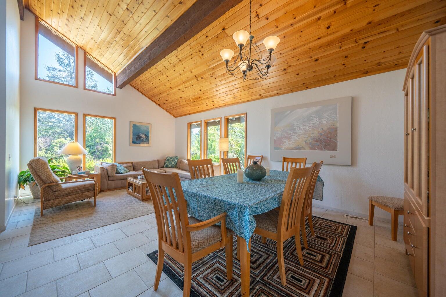 8846 Goldstone Lane Redding, CA 96001 - Photo 10 of 64 a view of a dining room with furniture a chandelier and wooden floor