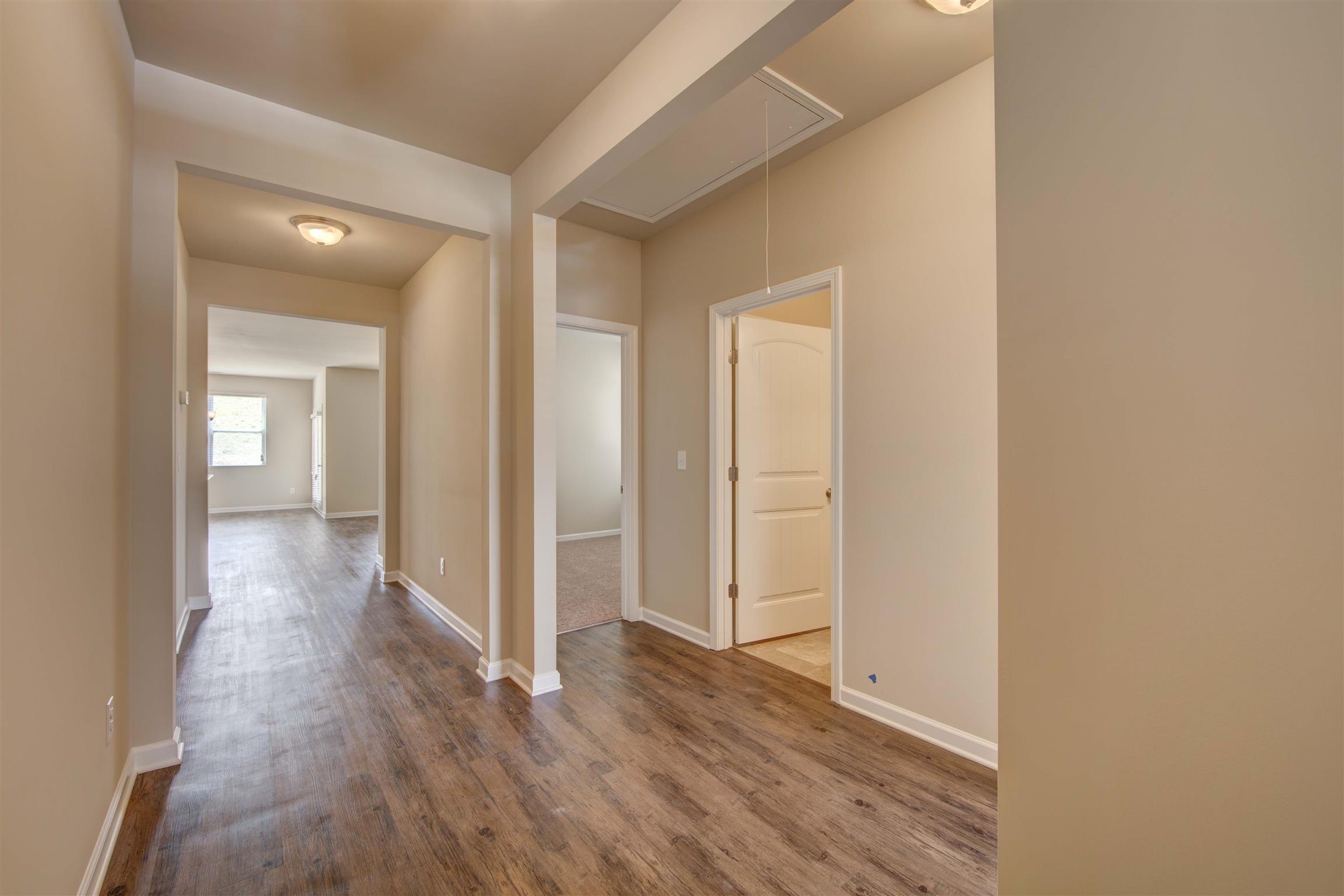 744 Prominence Road, Unit 66 Columbia, TN 38401 - Photo 3 of 17 a view of a hallway with wooden floor
