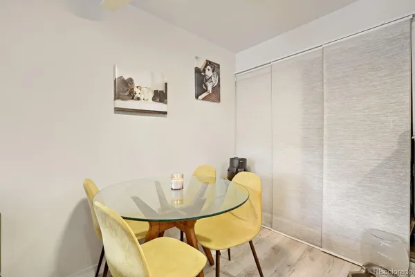 a view of a dining room with furniture and a window