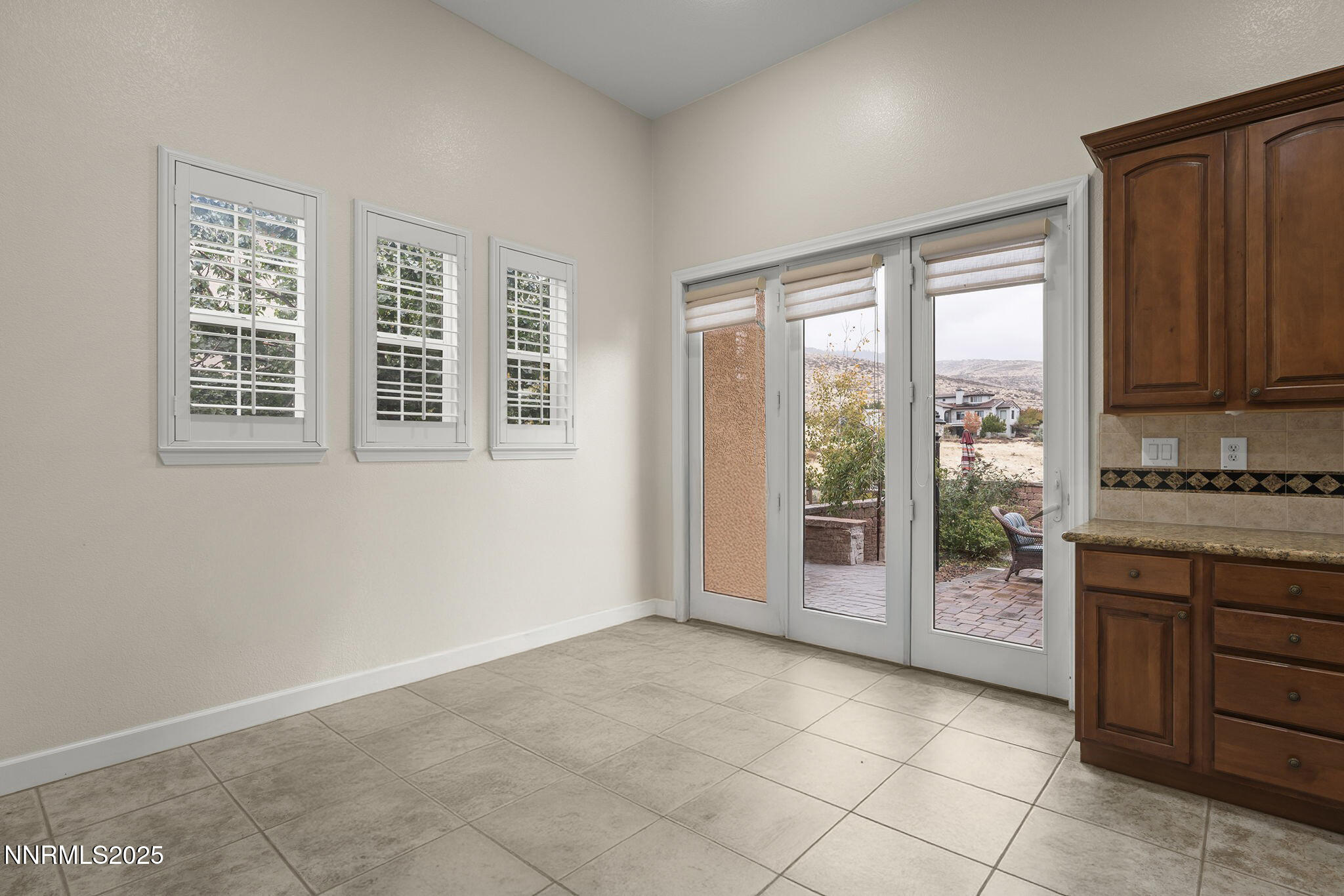 6225 Elk Ivory Drive Reno, NV 89511 - Photo 13 of 44 wooden floor in an empty room with a window