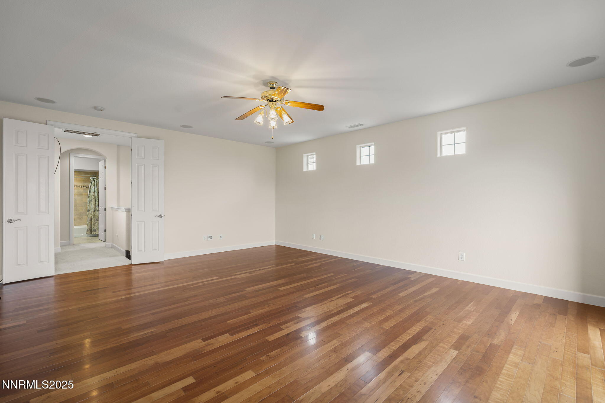 6225 Elk Ivory Drive Reno, NV 89511 - Photo 20 of 44 a view of an empty room with window and wooden floor