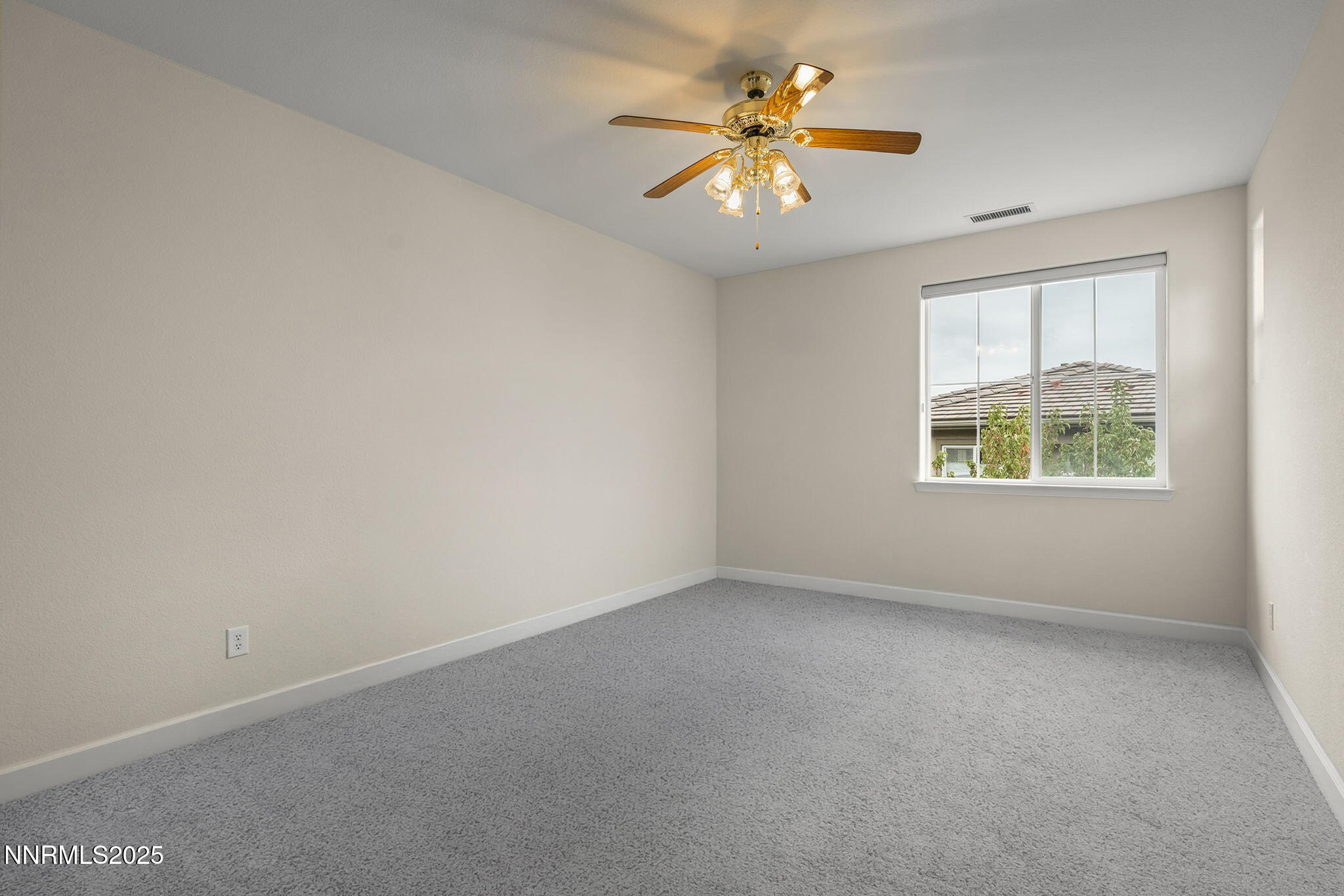 6225 Elk Ivory Drive Reno, NV 89511 - Photo 25 of 44 an empty room with a window
