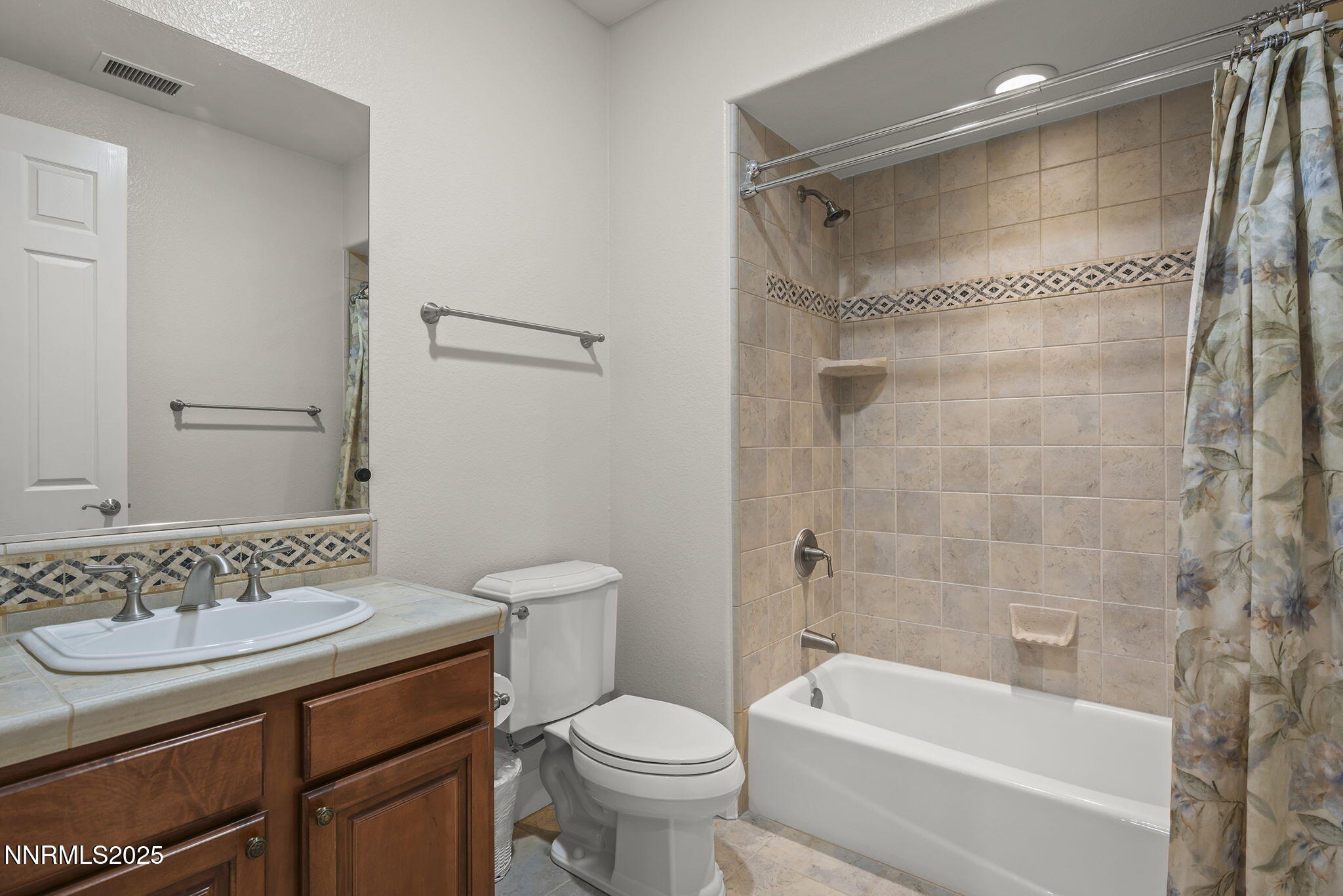 6225 Elk Ivory Drive Reno, NV 89511 - Photo 26 of 44 a bathroom with a sink toilet and shower