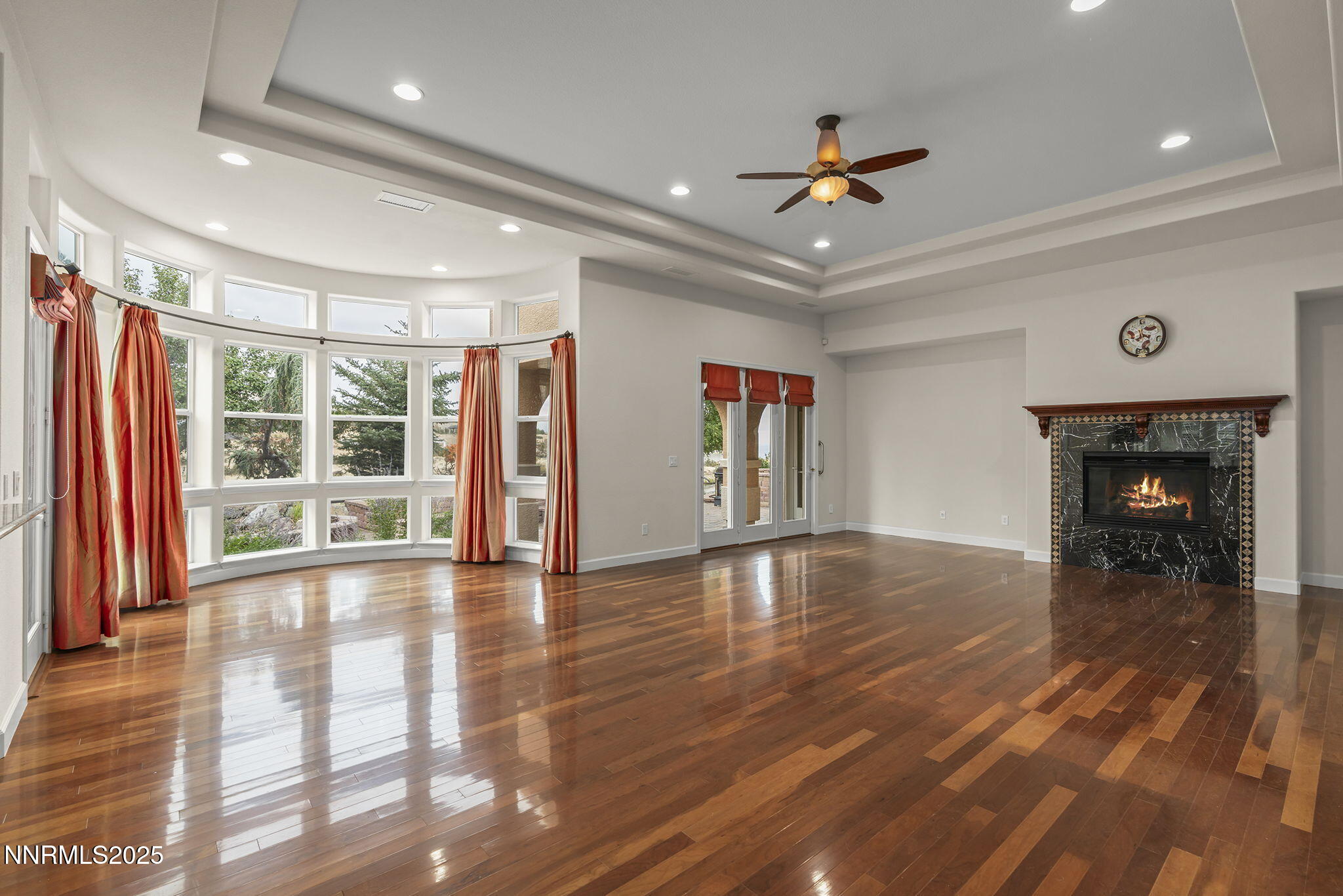 6225 Elk Ivory Drive Reno, NV 89511 - Photo 5 of 44 a view of an empty room with window and wooden floor