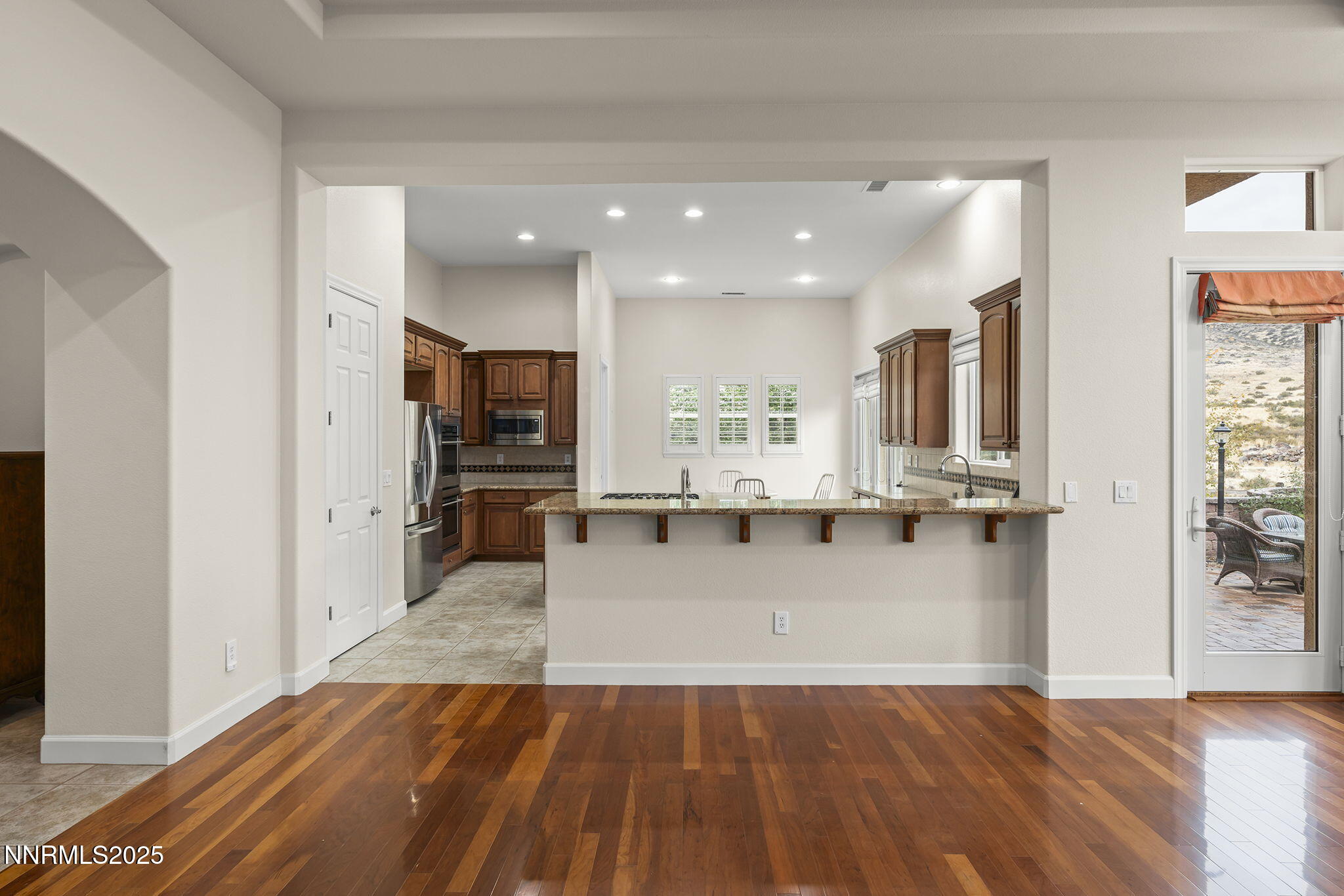 6225 Elk Ivory Drive Reno, NV 89511 - Photo 8 of 44 a view of kitchen with cabinets and wooden floor